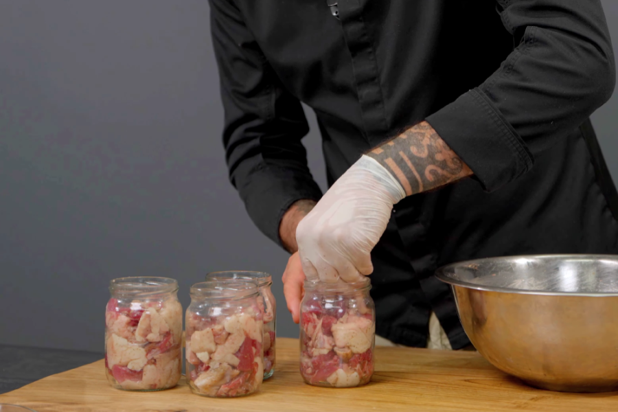 Put the meat into jars