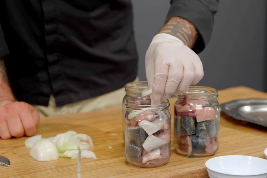 Putting the herring and onions into jars